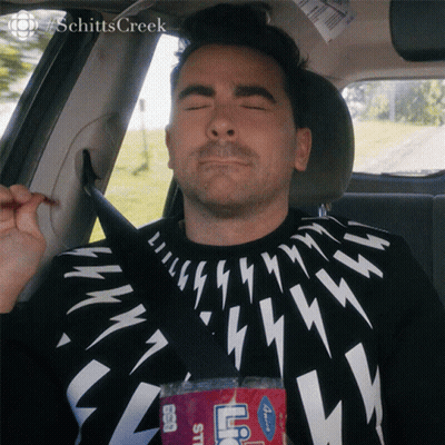 A Man Is Sitting In The Back Seat Of A Car With His Eyes Closed And A Bottle Of Ice Tea GIF