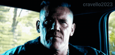 A Man Is Sitting In The Back Seat Of A Car With The Hashtag Cravello2023 On The Bottom GIF