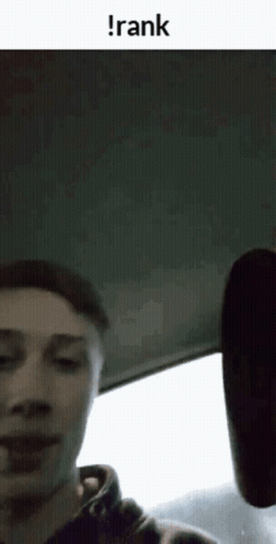 A Man Is Sitting In The Back Seat Of A Car With The Word Rank On The Bottom . GIF