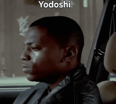 A Man Is Sitting In The Back Seat Of A Car With Yodoshi Written On The Bottom GIF