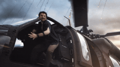 A Man Is Sitting In The Cockpit Of A Helicopter That Says U.s. Air Force On It GIF
