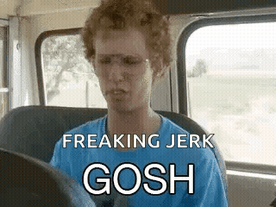 A Man Is Sitting In The Driver 'S Seat Of A Bus With Glasses On . GIF