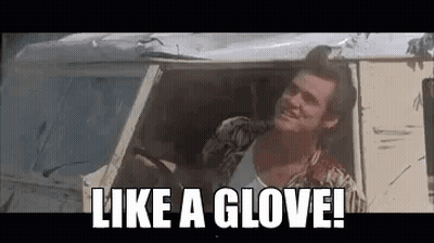 A Man Is Sitting In The Driver 'S Seat Of A Car And Says `` Like A Glove '' . GIF