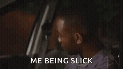 A Man Is Sitting In The Driver 'S Seat Of A Car With The Words `` Me Being Slick '' Written On The Screen . GIF