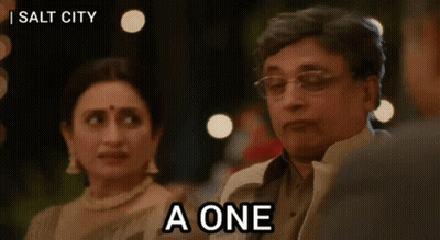 A Man Is Sitting Next To A Woman And Says A One GIF