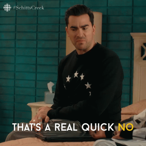 A Man Is Sitting On A Bed With The Words That 'S A Real Quick No GIF