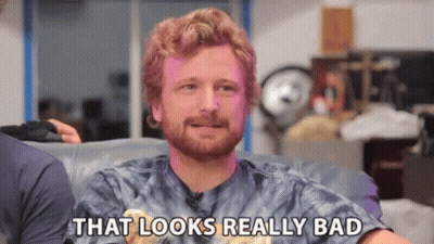 A Man Is Sitting On A Couch And Saying That Looks Really Bad GIF