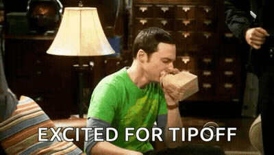 A Man Is Sitting On A Couch Eating A Bag Of Food With The Words Excited For Tipoff Written Above Him . GIF