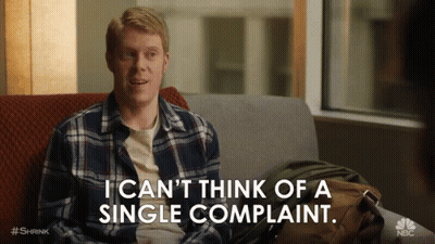 A Man Is Sitting On A Couch Saying I Can 'T Think Of A Single Complaint GIF