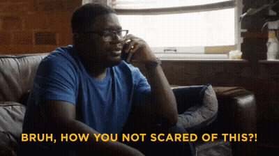 A Man Is Sitting On A Couch Talking On A Cell Phone And The Words Bruh How You Not Scared Of This GIF