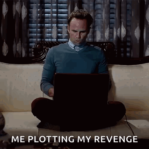 A Man Is Sitting On A Couch Using A Laptop Computer And Says Me Plotting My Revenge . GIF