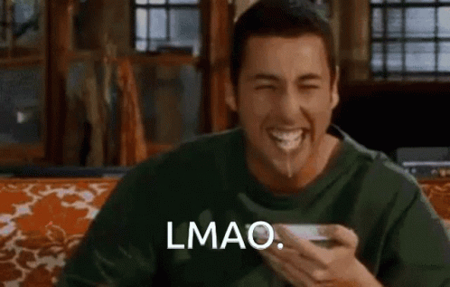 A Man Is Sitting On A Couch With A Bowl Of Food In His Mouth And Says Lmao . GIF
