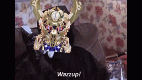 A Man Is Sitting On A Couch With A Clock On His Head And The Words Wazzup On The Bottom . GIF
