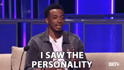 A Man Is Sitting On A Couch With A Microphone And Says " I Saw The Personality " GIF