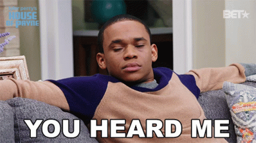 A Man Is Sitting On A Couch With His Eyes Closed And The Words You Heard Me Behind Him GIF