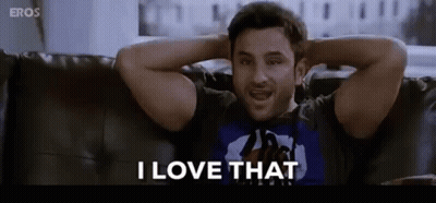 A Man Is Sitting On A Couch With His Hands Behind His Head Saying I Love That . GIF