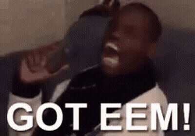 A Man Is Sitting On A Couch With His Mouth Open And The Words `` Got Eem '' Written On The Bottom . GIF