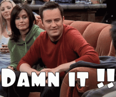 A Man Is Sitting On A Couch With The Words Damn It Written On The Bottom GIF