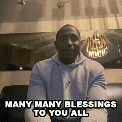 A Man Is Sitting On A Couch With The Words Many Many Blessings To You All GIF