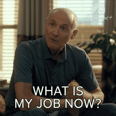 A Man Is Sitting On A Couch With The Words What Is My Job Now GIF