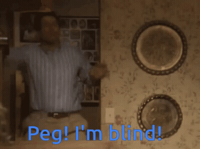A Man Is Sitting On A Set Of Stairs With The Words Peg I 'M Blind Below Him GIF