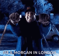 A Man Is Sitting On A Sled In The Snow And Making A Face . GIF