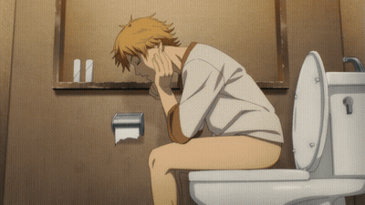 A Man Is Sitting On A Toilet With His Head On His Hand GIF