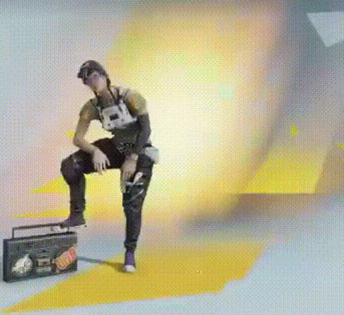 A Man Is Sitting On The Floor Next To A Boombox With A Sticker On It That Says ' I Love You ' GIF
