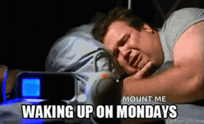 A Man Is Sleeping In A Bed With A Alarm Clock In The Background And The Words `` Mount Me Waking Up On Mondays '' . GIF