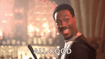 A Man Is Smiling And Holding A Bat And The Words `` All Good '' Are Written On The Screen . GIF