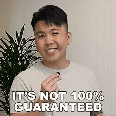 A Man Is Smiling And Holding A Microphone With The Words " It 'S Not 100 % Guaranteed " Next To Him GIF