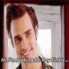 A Man Is Smiling And Looking For Ray Finkle . GIF