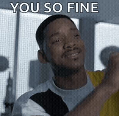 A Man Is Smiling And Saying `` You So Fine '' While Holding His Fist Up In The Air . GIF