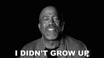 A Man Is Smiling In A Black And White Photo With The Words In A Castle Above Him GIF