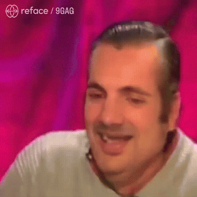 A Man Is Smiling In Front Of A Pink Background That Says Reface / 9Gag On It GIF