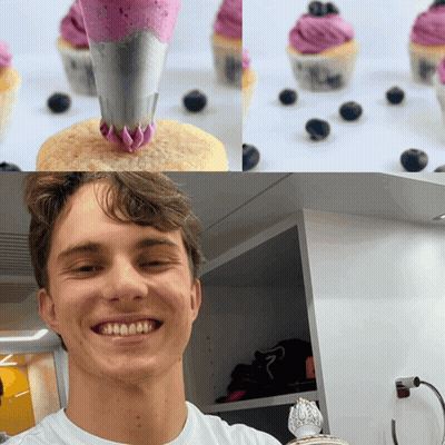 A Man Is Smiling In Front Of Cupcakes With Purple Frosting And Blueberries GIF