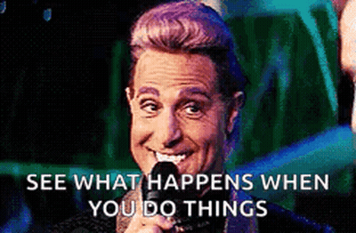 A Man Is Smiling While Holding A Microphone With The Words See What Happens When You Do Things Written Below Him . GIF