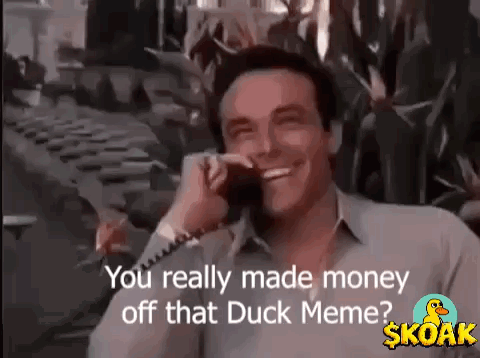 A Man Is Smiling While Talking On A Cell Phone And Says `` You Really Made Money Off That Duck Meme ? '' GIF