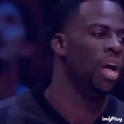 A Man Is Smiling With His Eyes Closed . GIF