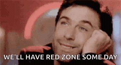 A Man Is Smiling With His Head Resting On His Hand And The Words `` We 'Ll Have Red Zone Some Day '' Written Below Him . GIF