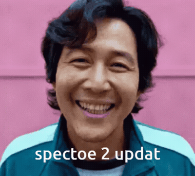 A Man Is Smiling With The Words " Spectoe 2 Updat " Written Below Him GIF