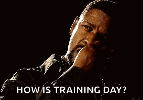 A Man Is Smoking A Cigarette In A Dark Room And Asking How Is Training Day . GIF