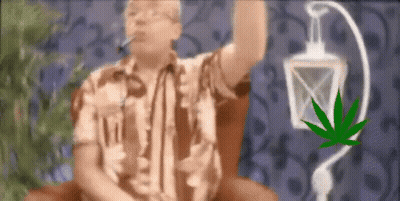 A Man Is Smoking A Cigarette Next To A Marijuana Leaf And A Lantern . GIF