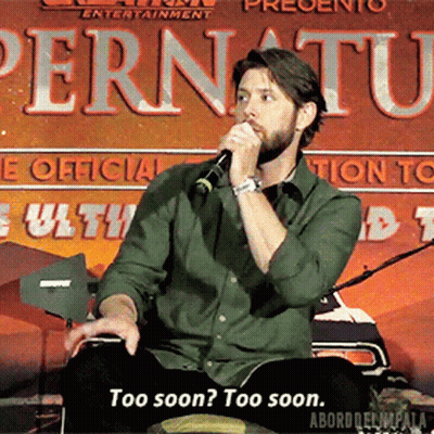 A Man Is Speaking Into A Microphone In Front Of A Sign That Says Pernuatu GIF
