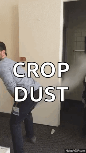 A Man Is Spraying Crop Dust On The Door GIF
