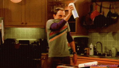 A Man Is Spraying Something In A Kitchen With The Words Box Video Downloader Behind Him GIF