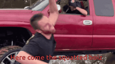 A Man Is Squatting In Front Of A Red Truck With The Words Here Come The Squatted Boiz Below Him GIF