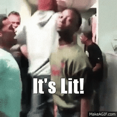 A Man Is Standing In A Crowd Of People With The Words `` It 'S Lit '' Written On The Bottom . GIF
