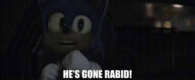 A Man Is Standing In A Dark Room And Says He 'S Gone Rabid GIF