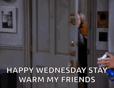 A Man Is Standing In A Doorway With The Words Happy Wednesday Stay Warm My Friends GIF